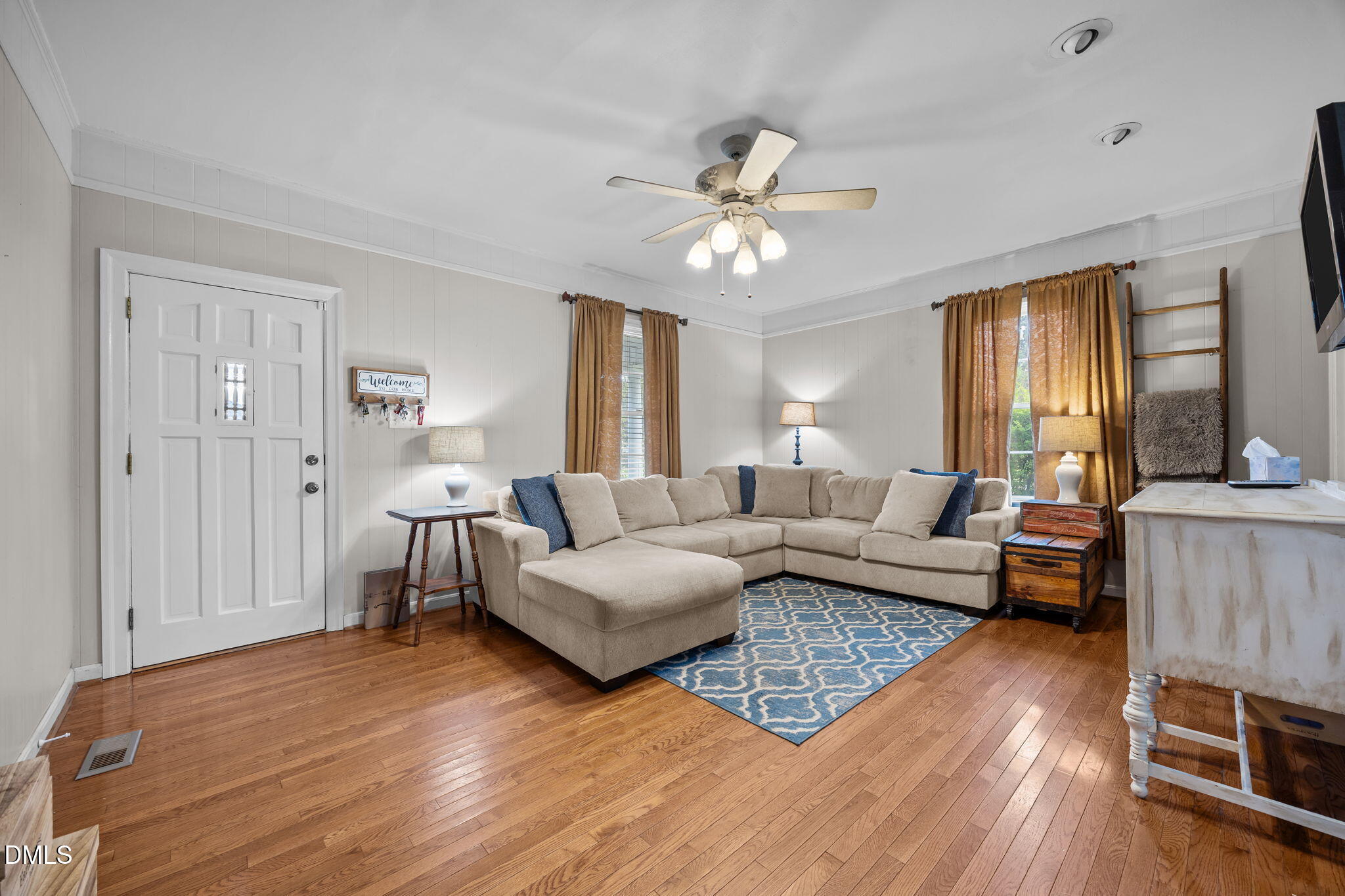203 North 11th Street Erwin, NC 28339 - Photo 5 of 27 a living room with furniture and a large window