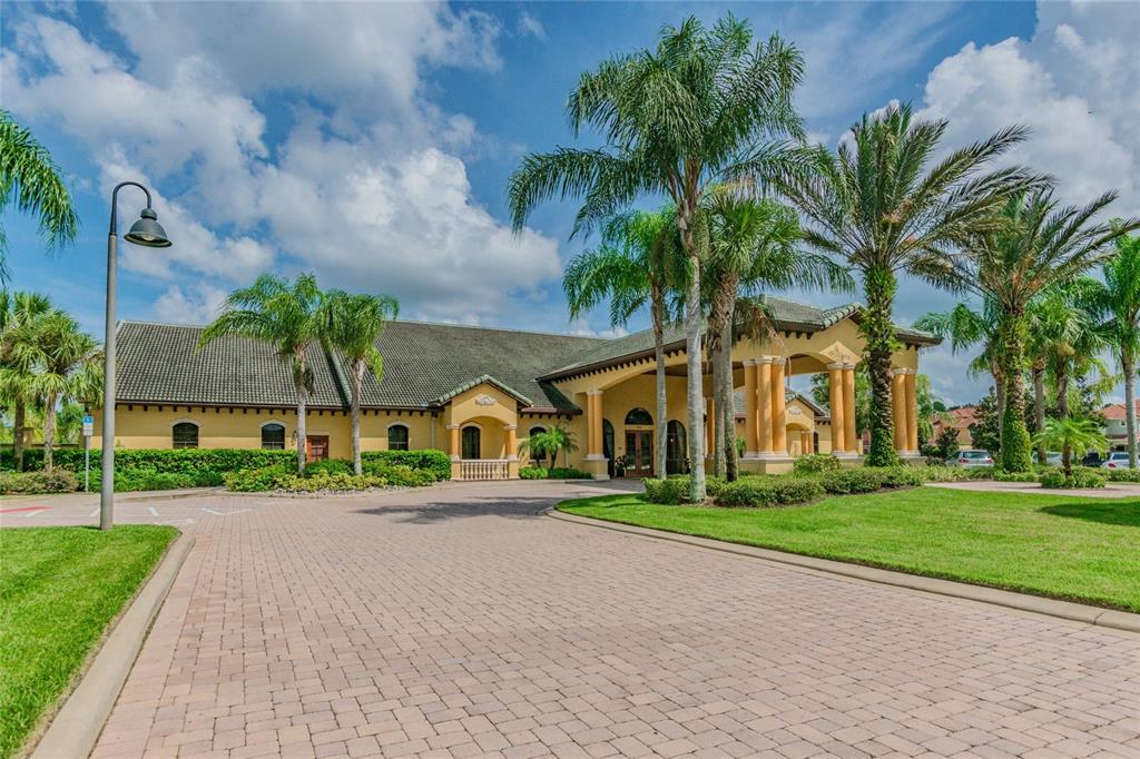 8841 Candy Palm Road Kissimmee, FL 34747 - Photo 38 of 49 a view of house with a yard and palm trees