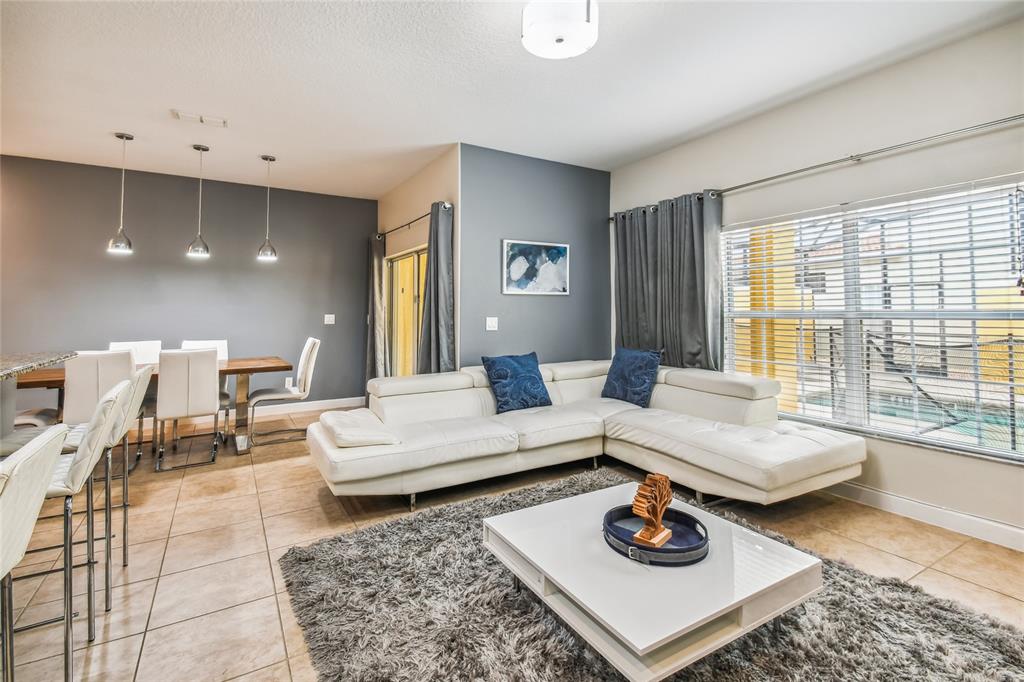 8841 Candy Palm Road Kissimmee, FL 34747 - Photo 7 of 49 a living room with furniture and a table