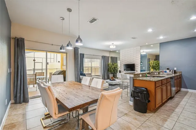 a bedroom with a bed and a lamp on table