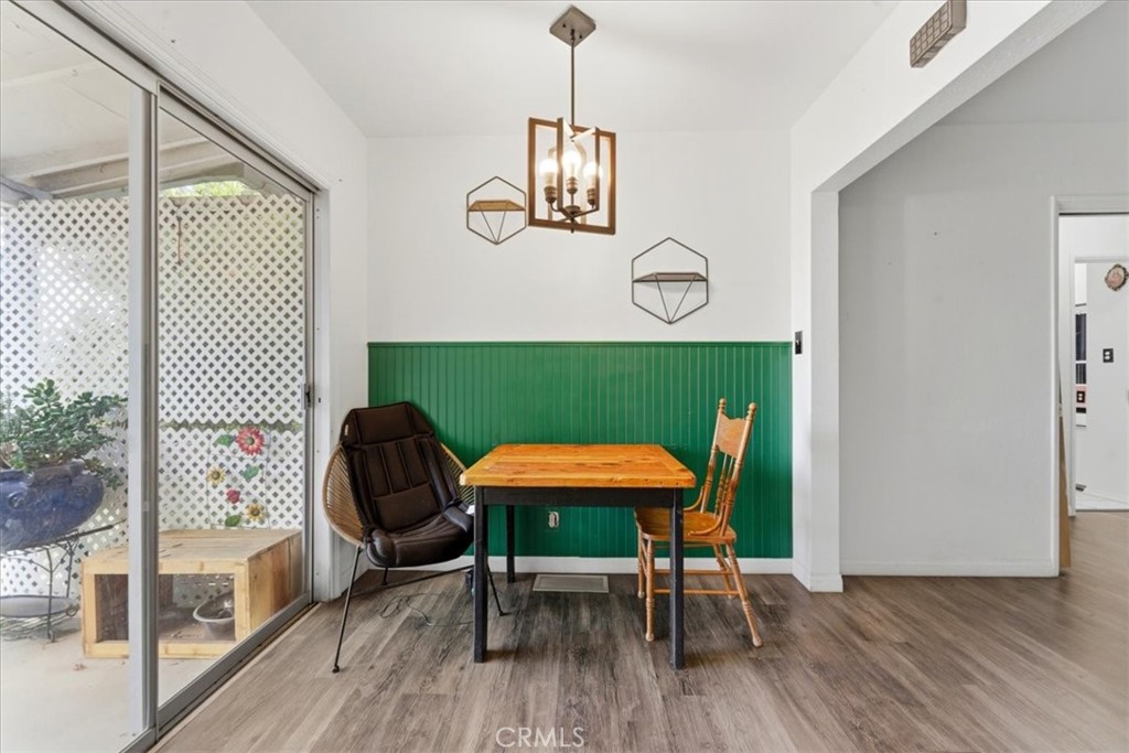 34863 Wildwood Canyon Road Yucaipa, CA 92399 - Photo 6 of 22 a view of a dining room with furniture and wooden floor