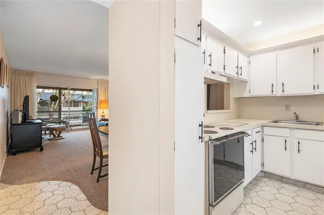 a kitchen with cabinets and appliances