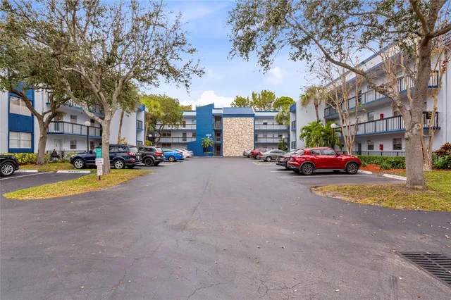 a view of street with parked cars