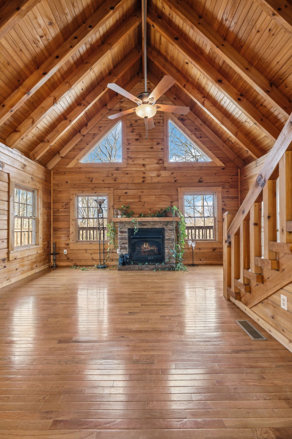 4485 Coconut Ridge Road Smithville, TN 37166 - Photo 5 of 33 a view of an empty room with wooden floor fireplace and a window