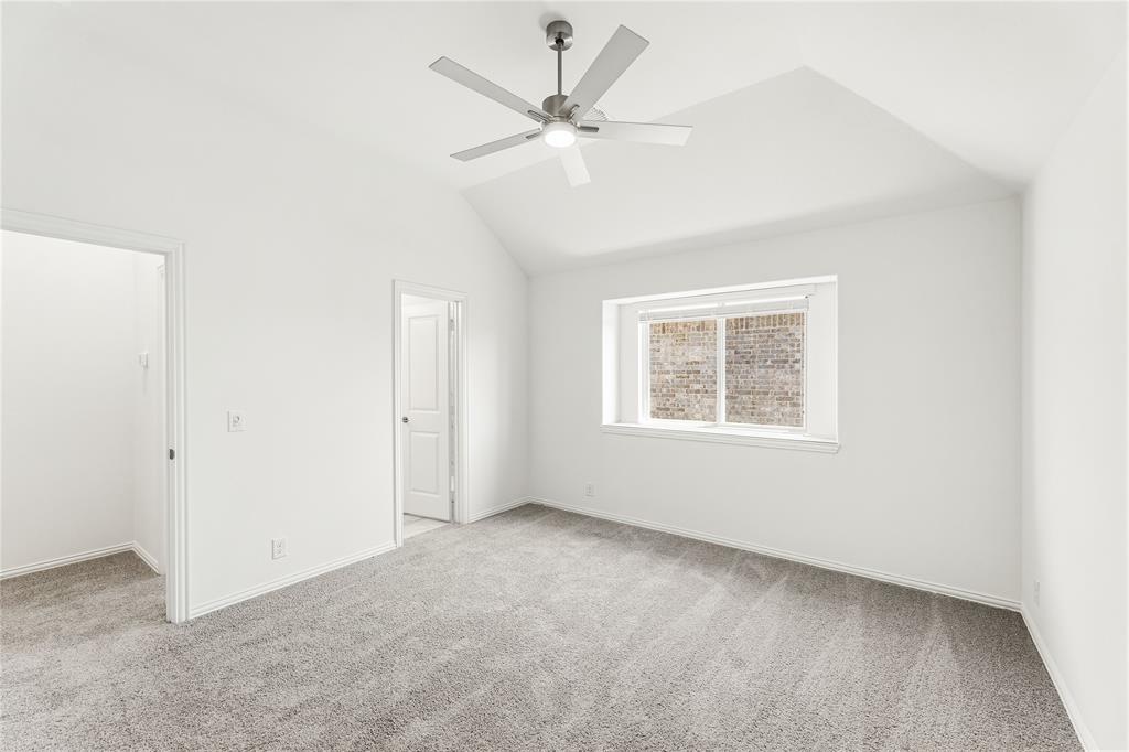 1145 Hitching Post Way Oak Point, TX 75068 - Photo 34 of 39 an empty room with a window and a ceiling fan