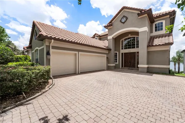 a front view of a house with a garage