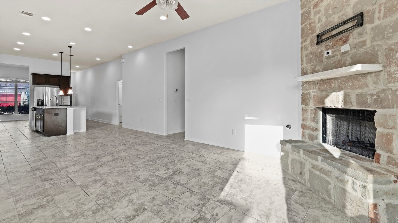 135 Simon Kyle, TX 78640 - Photo 24 of 28 a living room with furniture and a fireplace