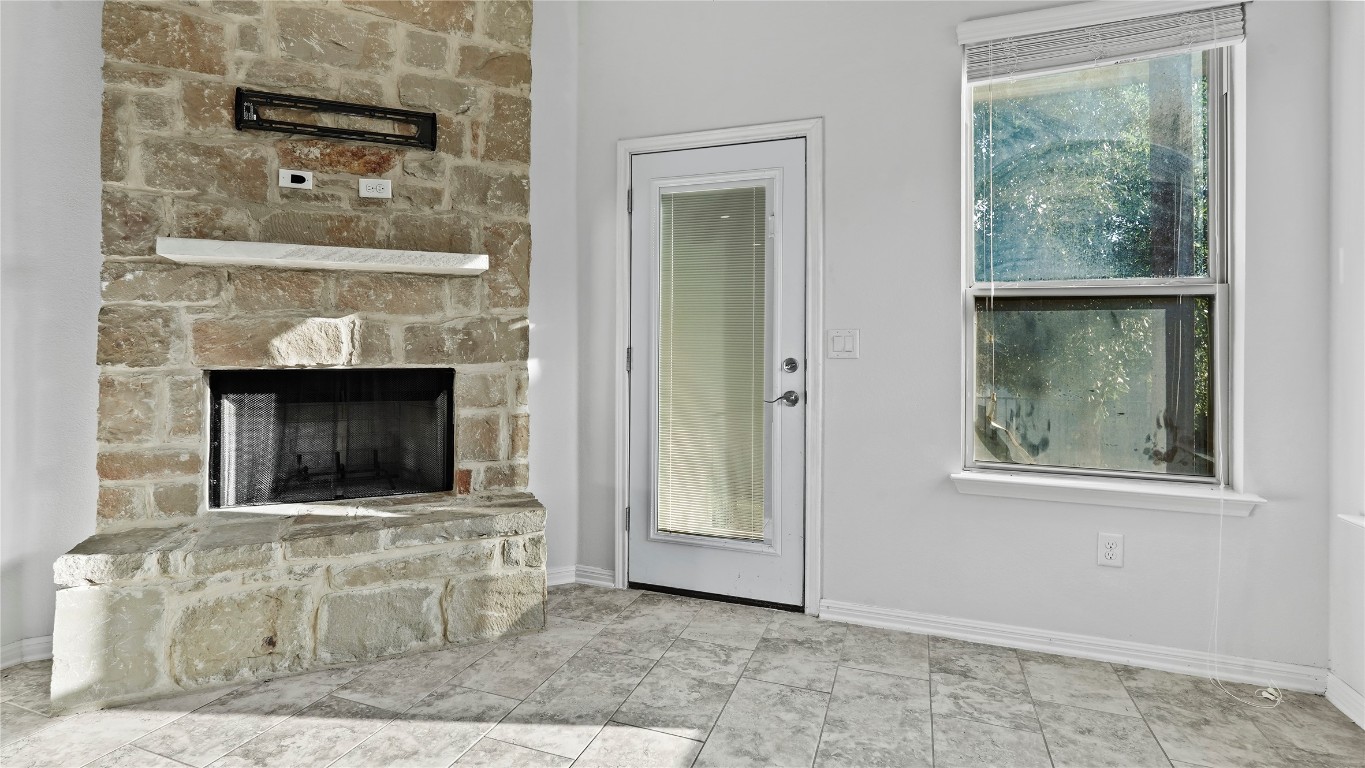 135 Simon Kyle, TX 78640 - Photo 25 of 28 a living room with a fireplace