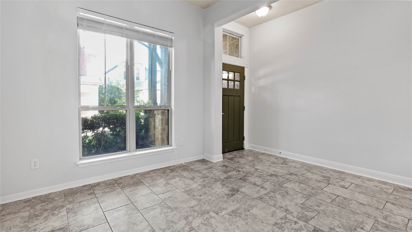 135 Simon Kyle, TX 78640 - Photo 5 of 28 a view of an empty room with window