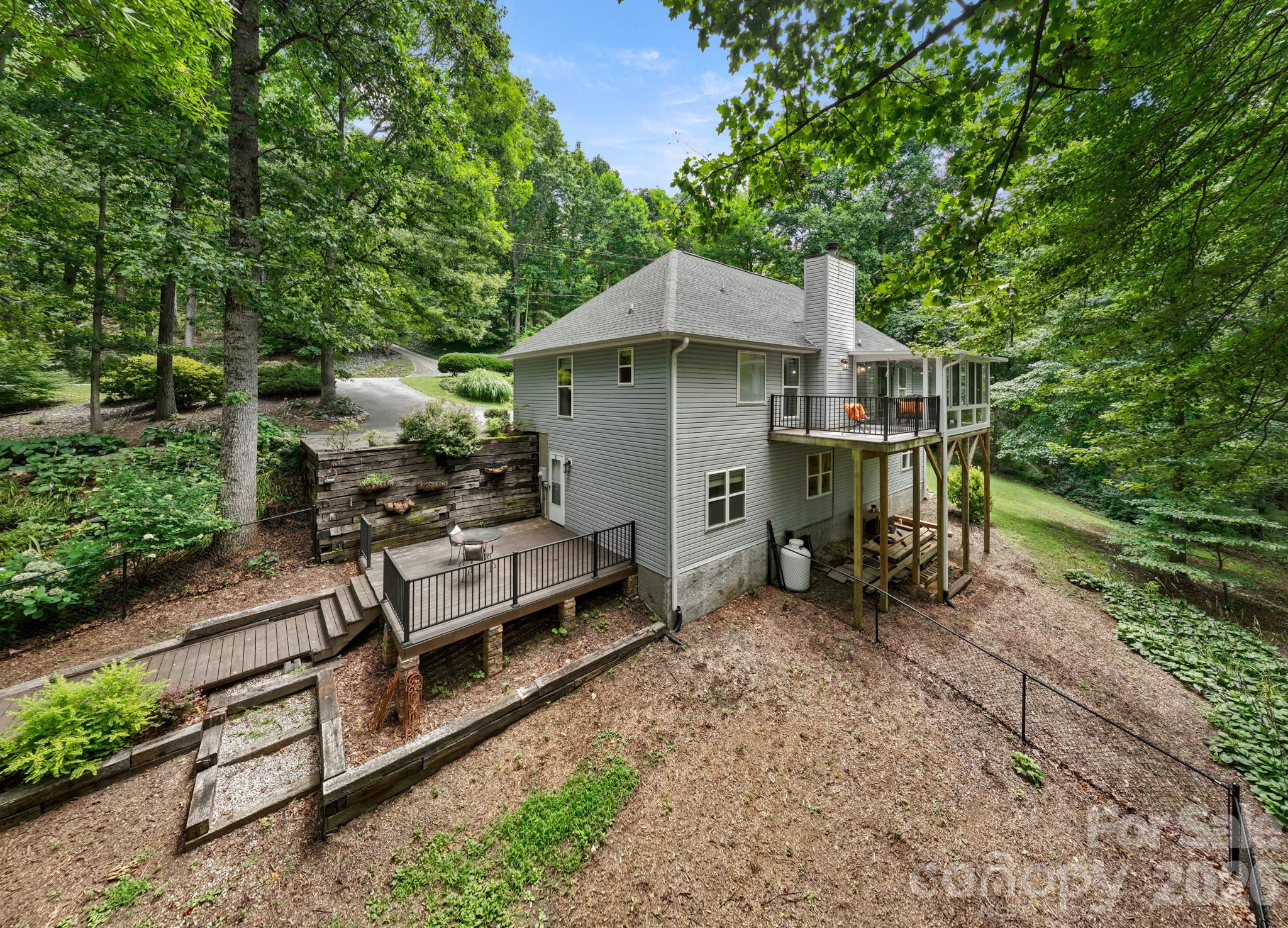 a view of a house with a yard and sitting area