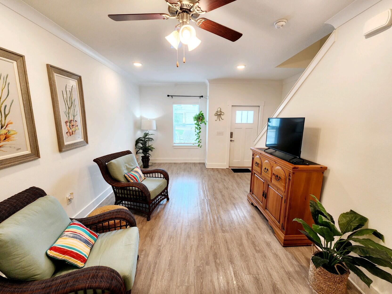266 North Sand Palm Road Freeport, FL 32439 - Photo 4 of 34 a living room with furniture and a flat screen tv