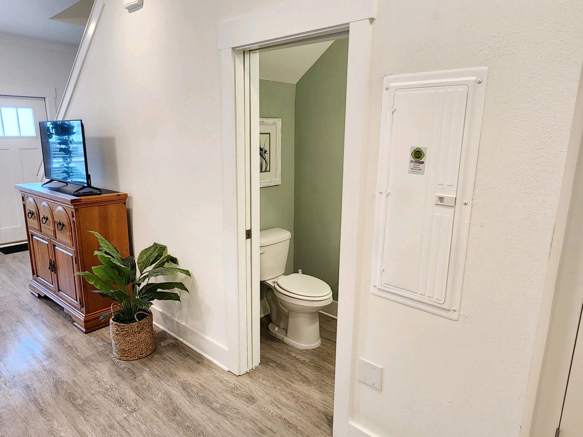 266 North Sand Palm Road Freeport, FL 32439 - Photo 5 of 34 a bathroom with a toilet a sink and mirror