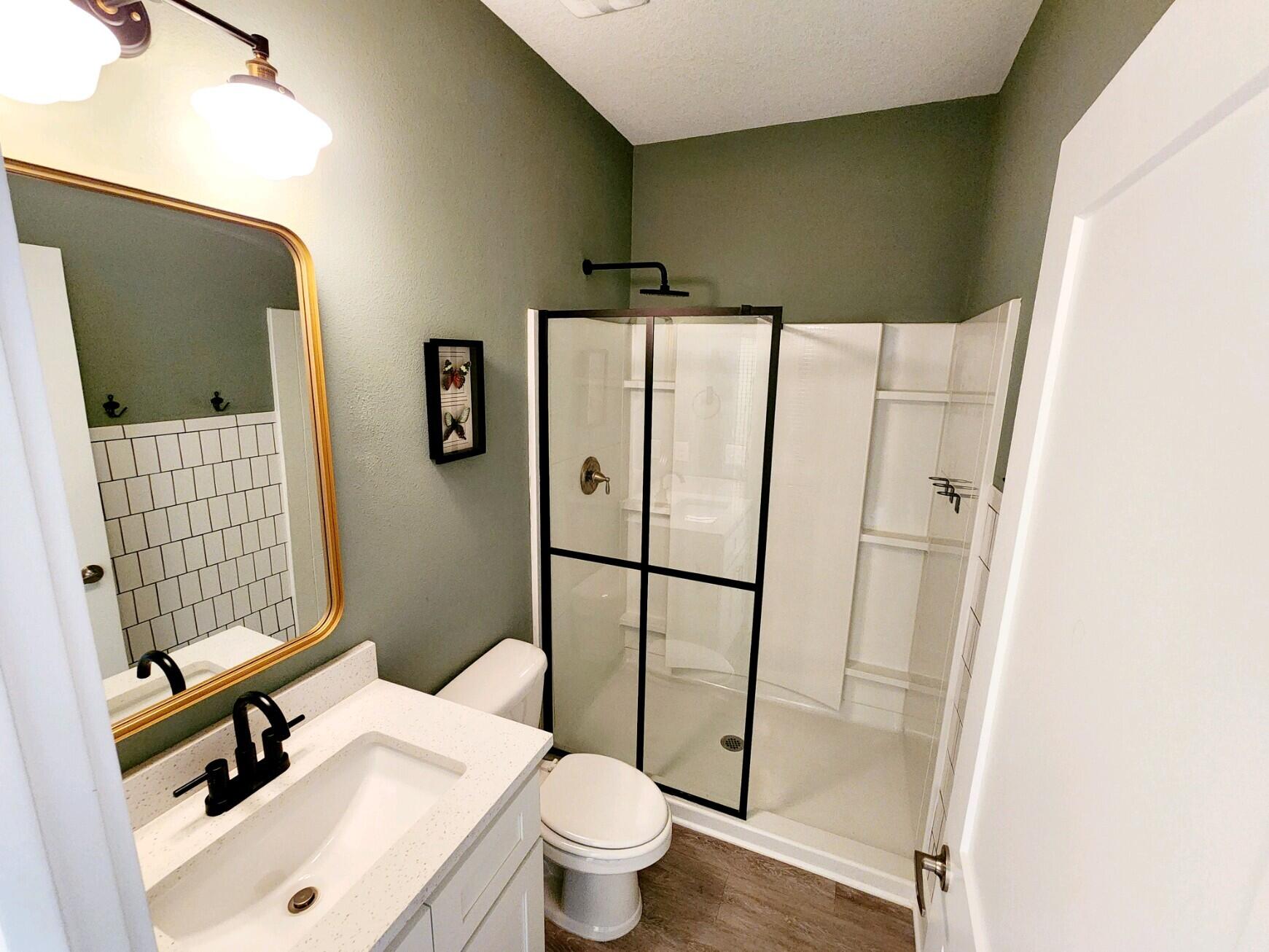 266 North Sand Palm Road Freeport, FL 32439 - Photo 8 of 34 a bathroom with a sink toilet and shower
