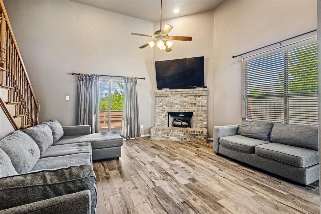 1 Pleasant Valley Sanger, TX 76266 - Photo 4 of 37 The sliding doors and large windows allow plenty of natural light to enter the living room.