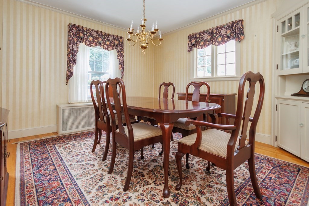 268 Beverly Road Worcester, MA 01605 - Photo 12 of 28 a view of a dining room with furniture and chandelier