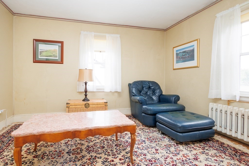 268 Beverly Road Worcester, MA 01605 - Photo 14 of 28 a living room with a couch and a dresser