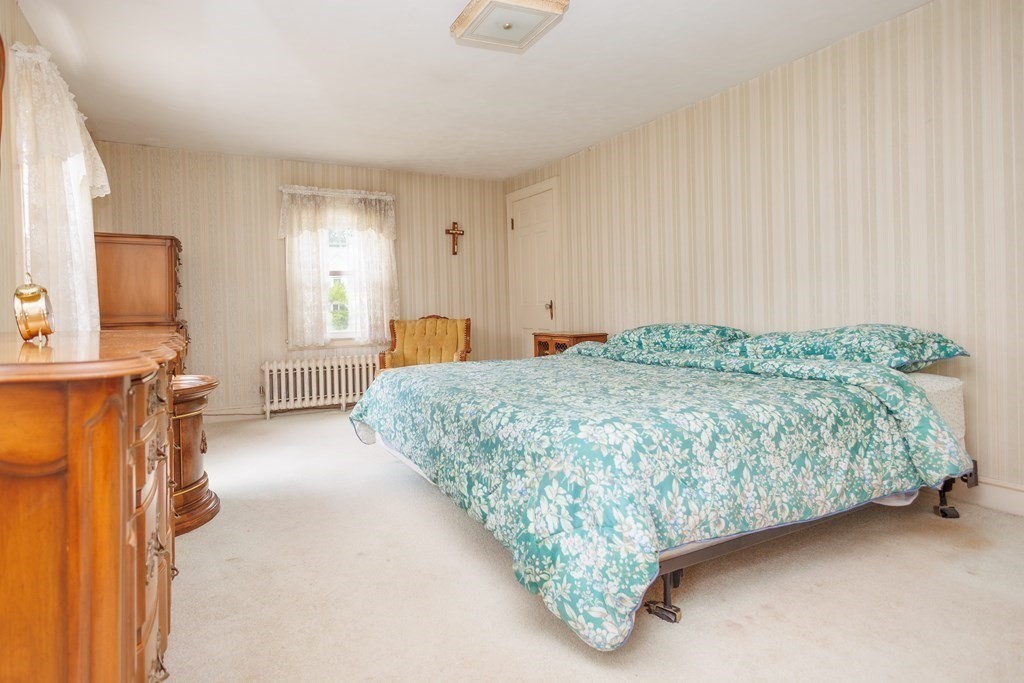 268 Beverly Road Worcester, MA 01605 - Photo 20 of 28 a spacious bedroom with a bed and a cabinets