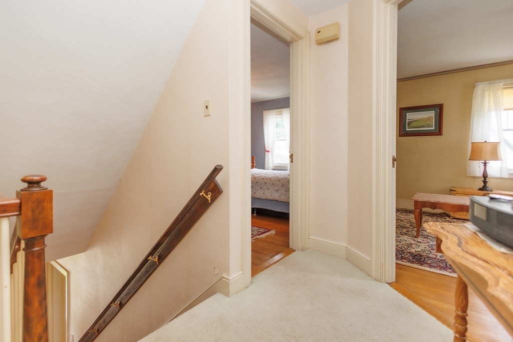 268 Beverly Road Worcester, MA 01605 - Photo 23 of 28 a view of a hallway view with wooden floor and staircase