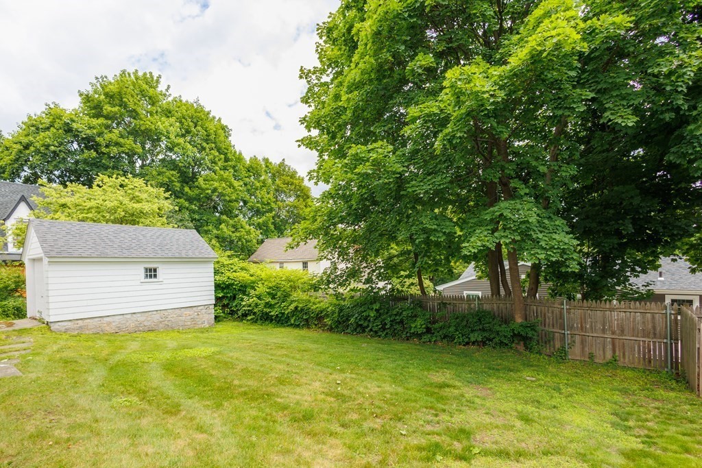 268 Beverly Road Worcester, MA 01605 - Photo 25 of 28 a front view of a house with a yard and a garage