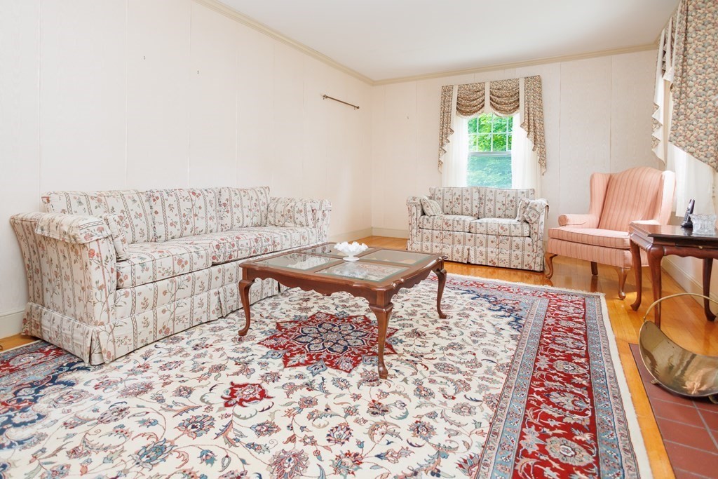 268 Beverly Road Worcester, MA 01605 - Photo 3 of 28 a living room with furniture and a rug