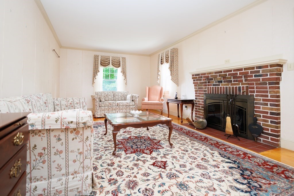 268 Beverly Road Worcester, MA 01605 - Photo 4 of 28 a living room with furniture a window and a fireplace