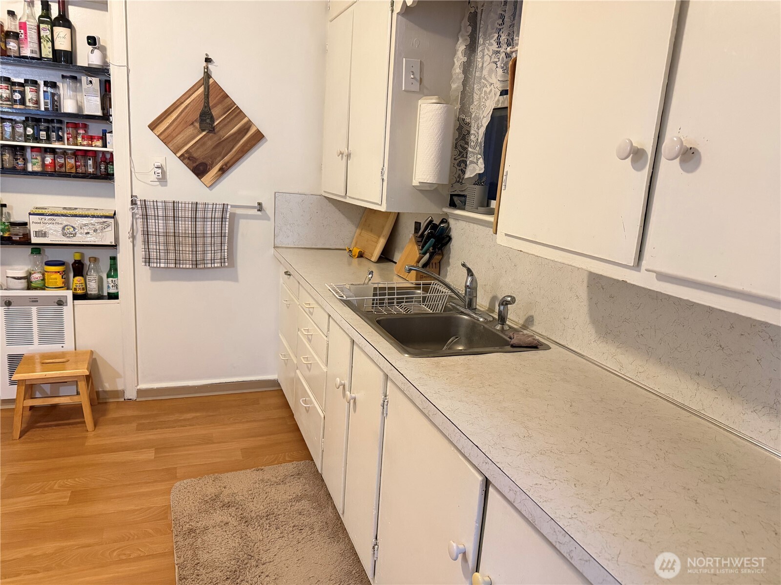 409 Birch Street South Omak, WA 98841 - Photo 13 of 32 a kitchen with a sink a stove and cabinets
