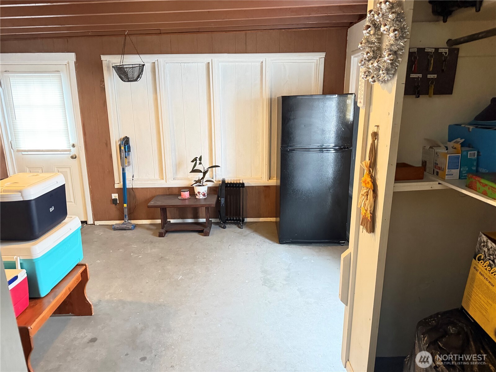 409 Birch Street South Omak, WA 98841 - Photo 20 of 32 a living room with furniture and a large window