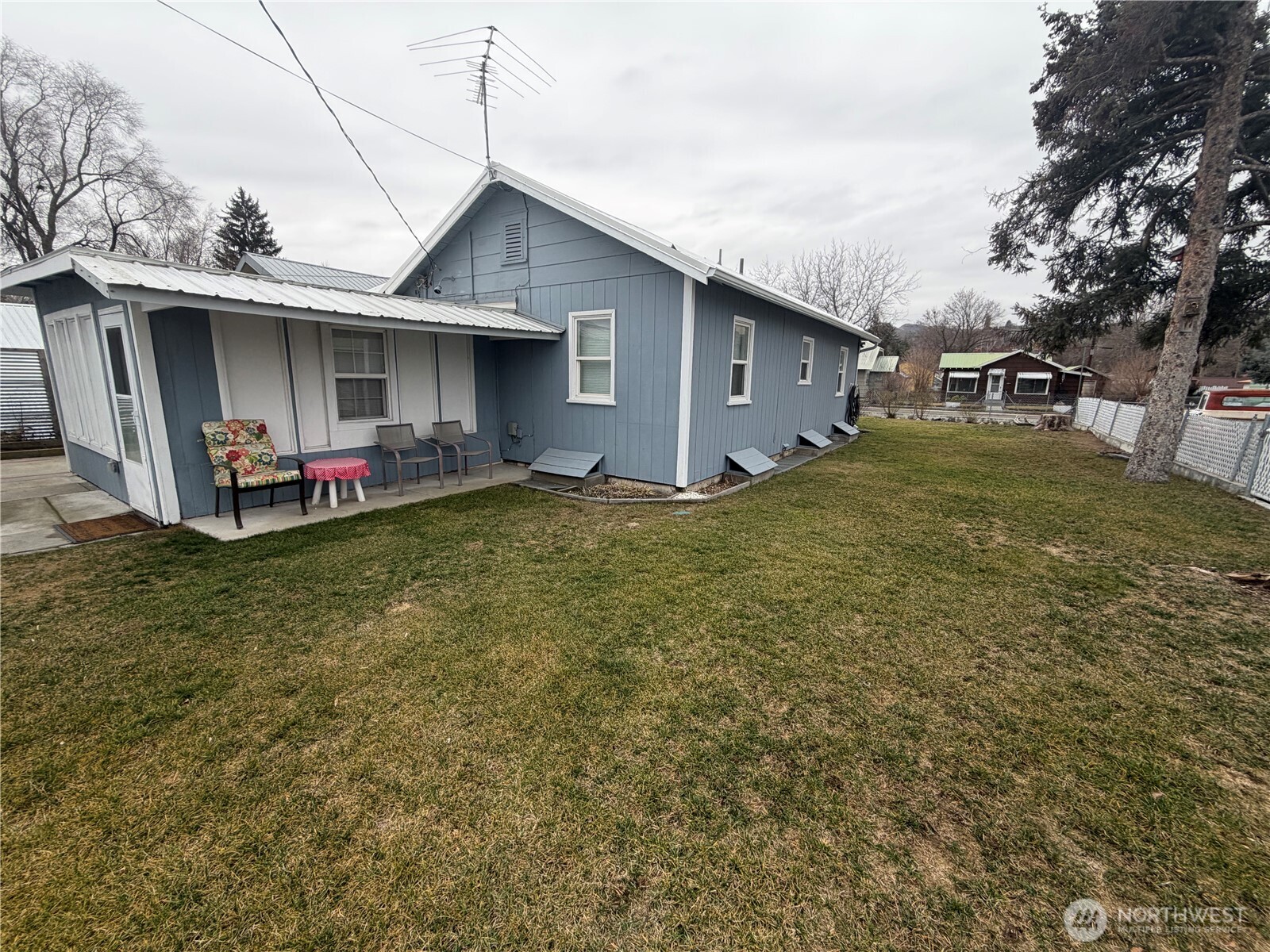 409 Birch Street South Omak, WA 98841 - Photo 5 of 32 a front view of a house with a yard