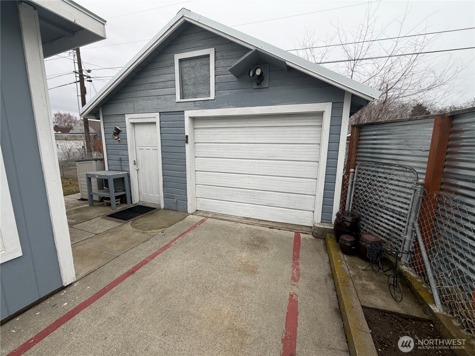 409 Birch Street South Omak, WA 98841 - Photo 7 of 32 a view of a house with garage
