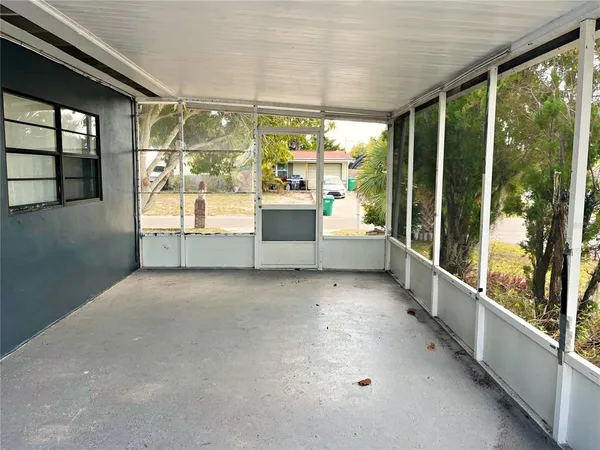 a view of a backyard of the house
