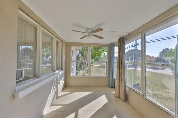 a living room with furniture and windows