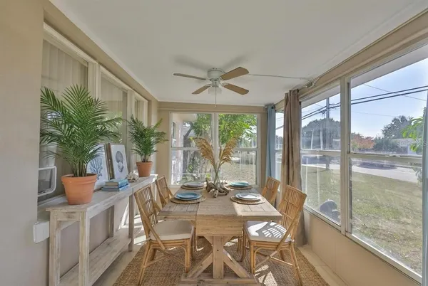 a view of a dining room with furniture window and outside view