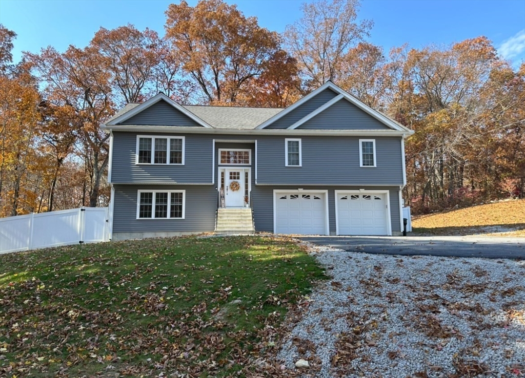 67 Mason Road Dudley, MA 01571 - Photo 3 of 33 a front view of a house with yard