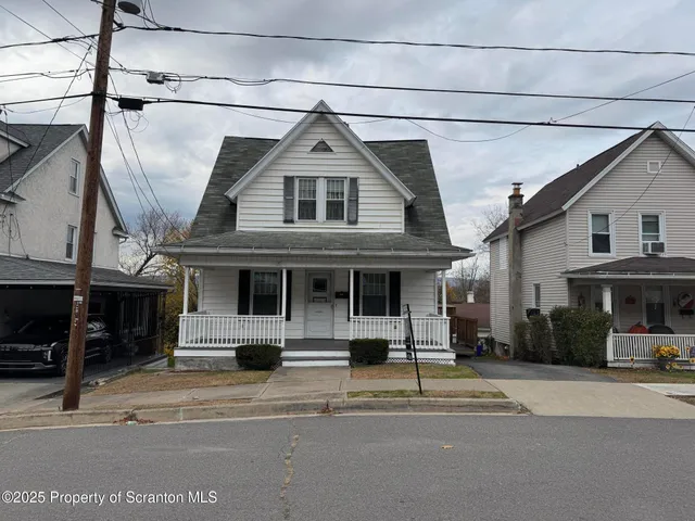 a car parked in front of a house