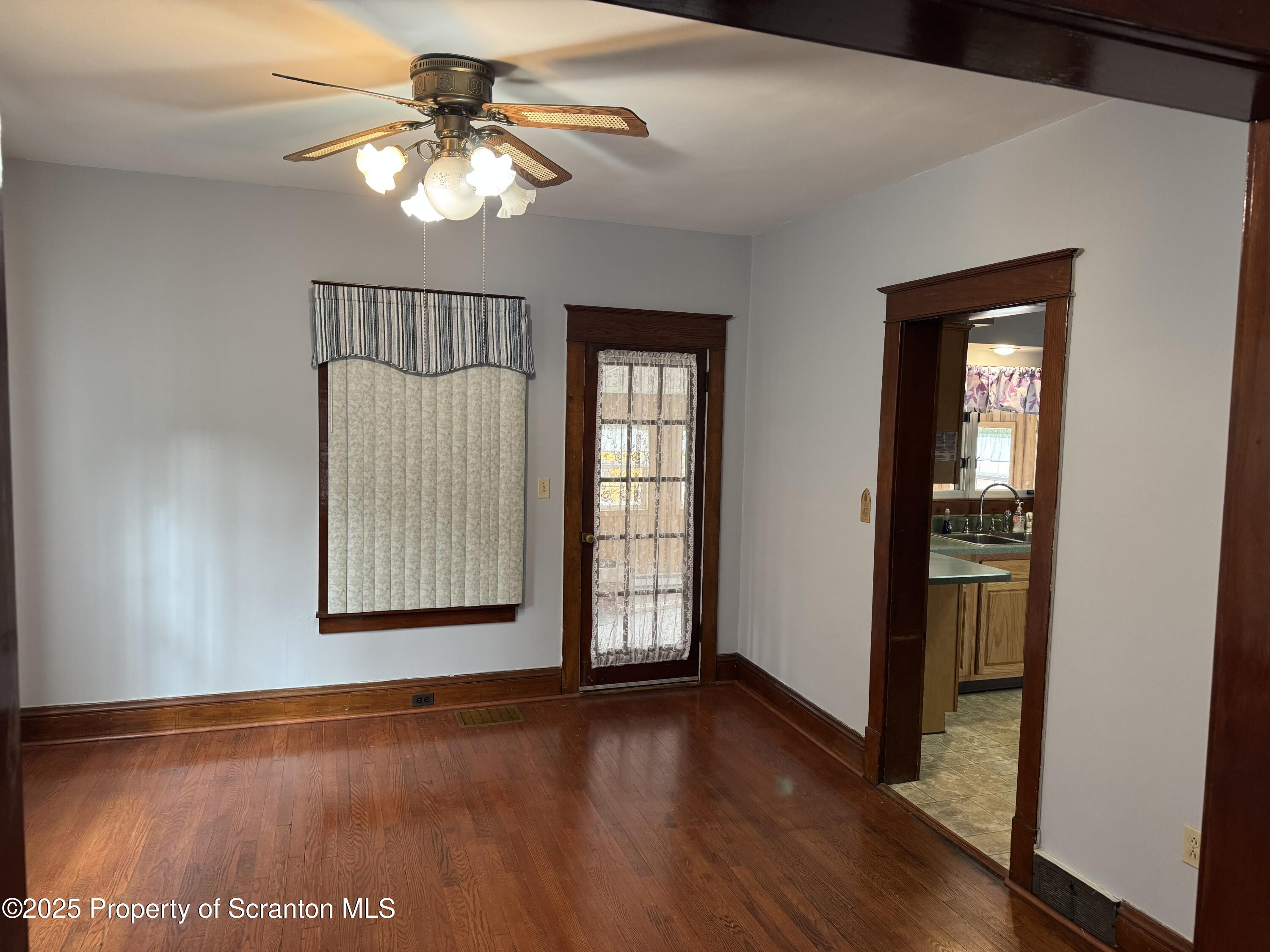 837 Matthew Avenue Scranton, PA 18510 - Photo 12 of 31 a view of an empty room with window and wooden floor