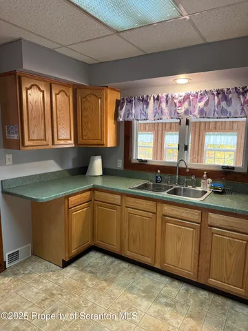 a bathroom with a sink toilet and tub