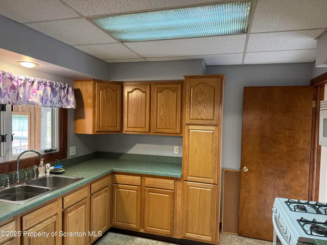 a bathroom with a bathtub and window