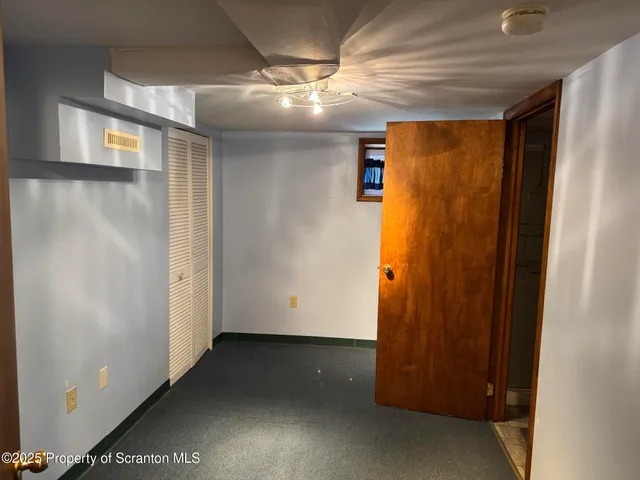 an entryway with wooden floor