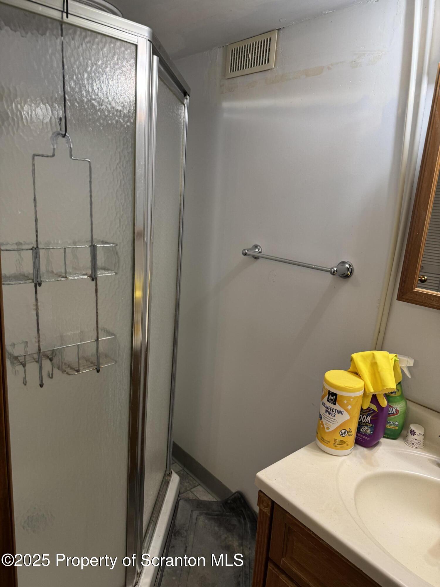 837 Matthew Avenue Scranton, PA 18510 - Photo 27 of 31 a bathroom with a sink and vanity