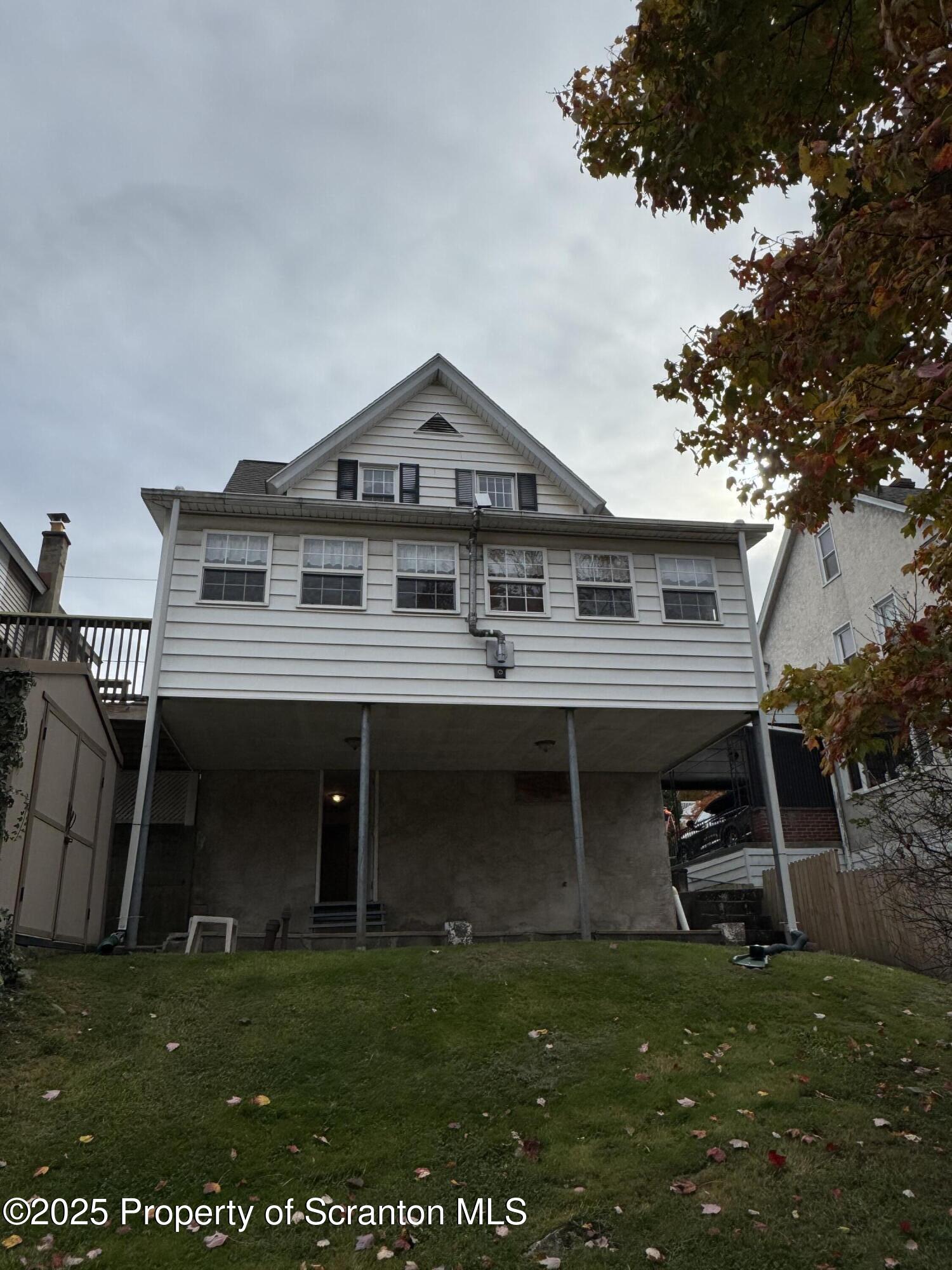 837 Matthew Avenue Scranton, PA 18510 - Photo 6 of 31 a front view of a house with a garden