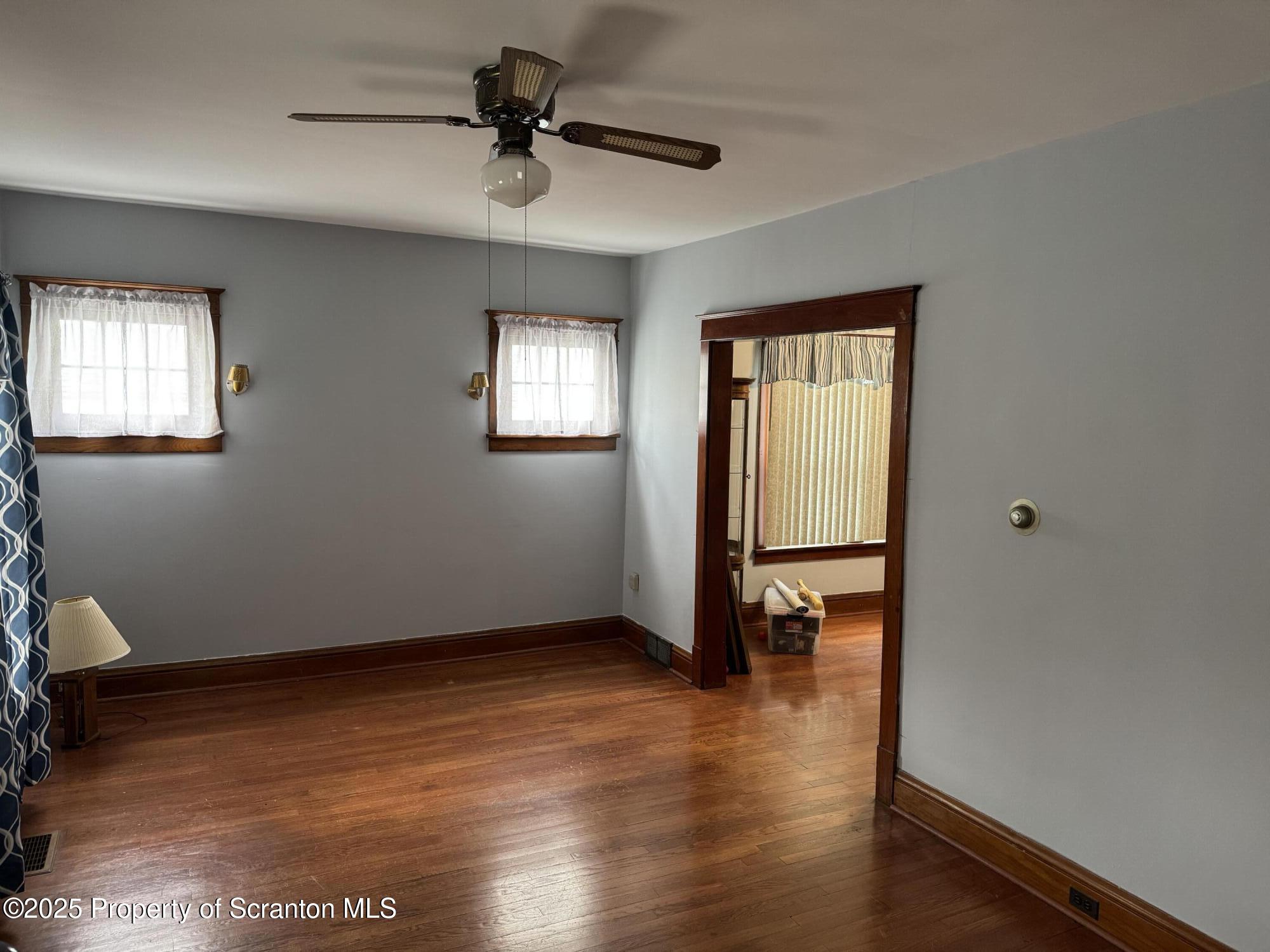 837 Matthew Avenue Scranton, PA 18510 - Photo 9 of 31 a view of an empty room with window and wooden floor