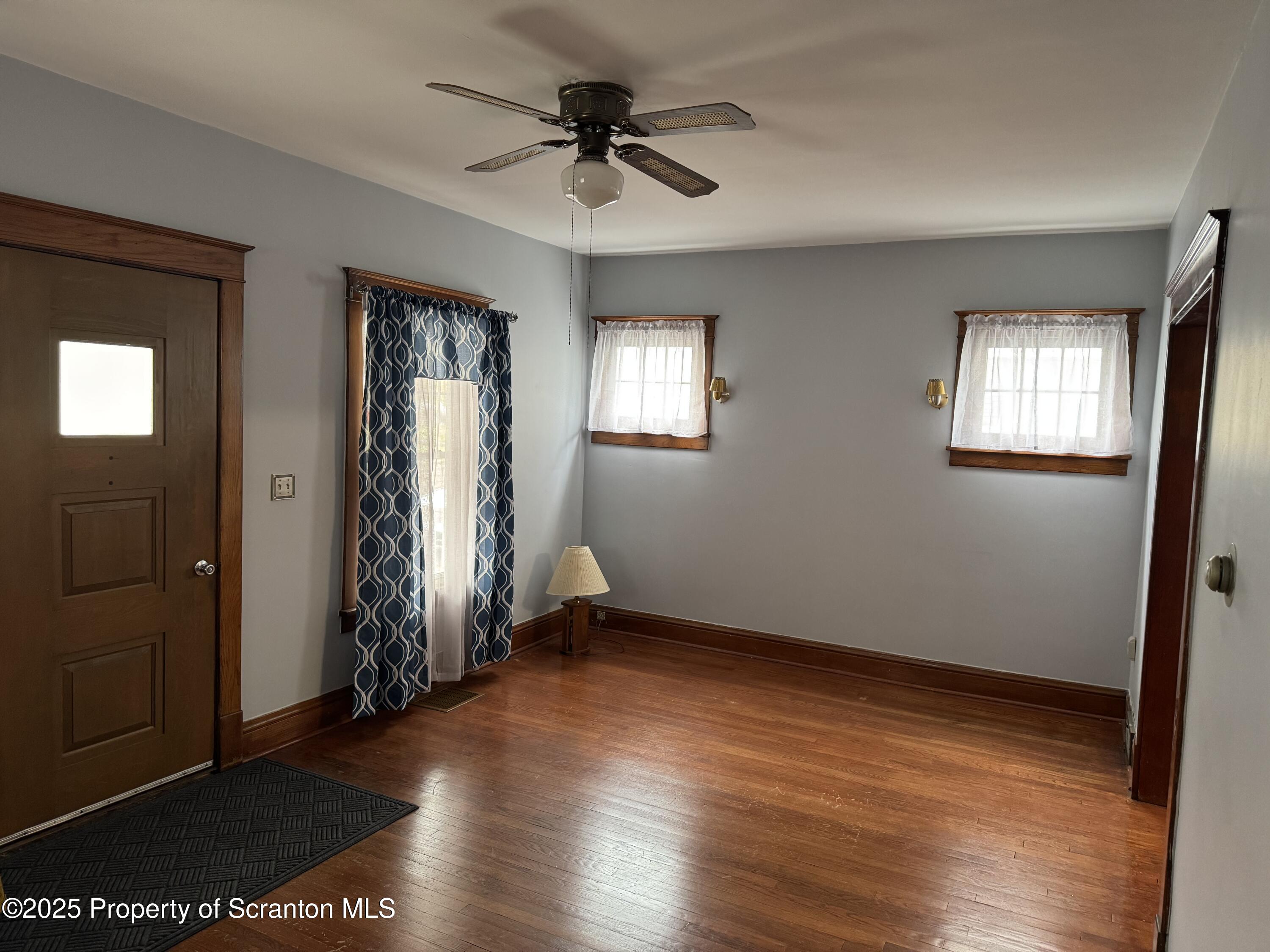 837 Matthew Avenue Scranton, PA 18510 - Photo 10 of 31 an empty room with wooden floor and windows