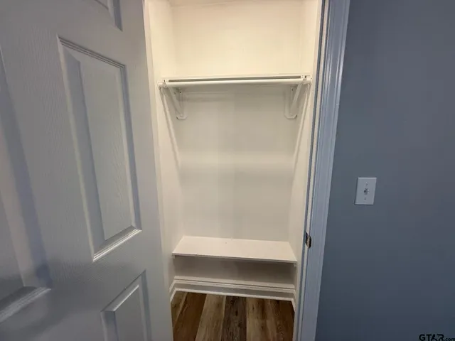 a bathroom with a sink a toilet and a window