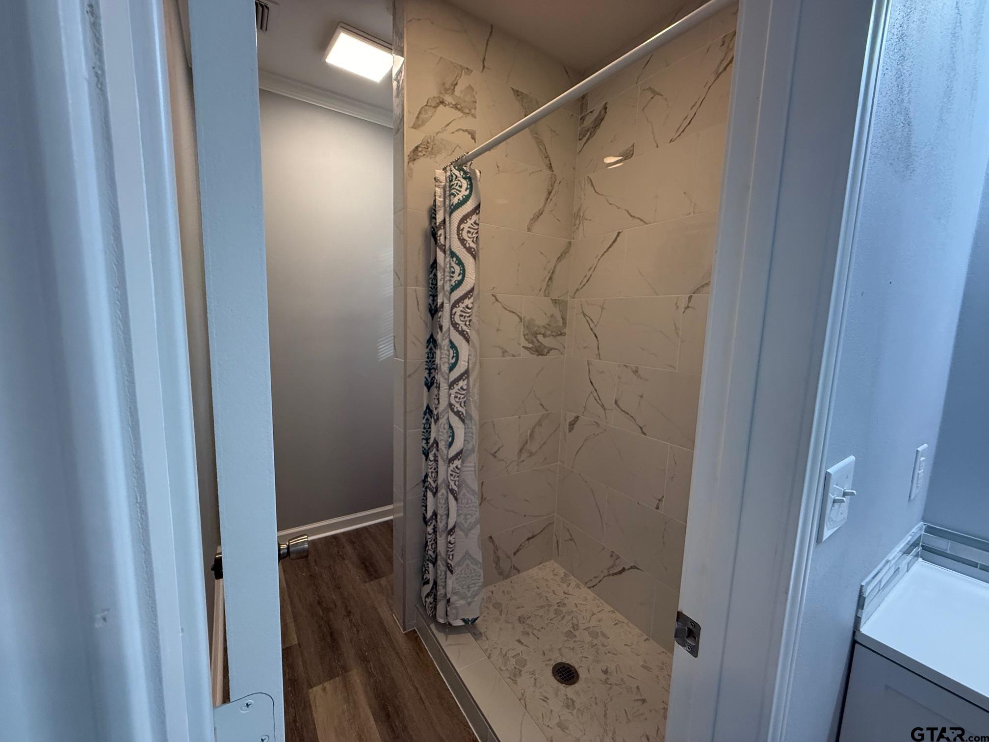 3248 Highway 79 Henderson, TX 75652 - Photo 21 of 44 a bathroom with a glass door shower