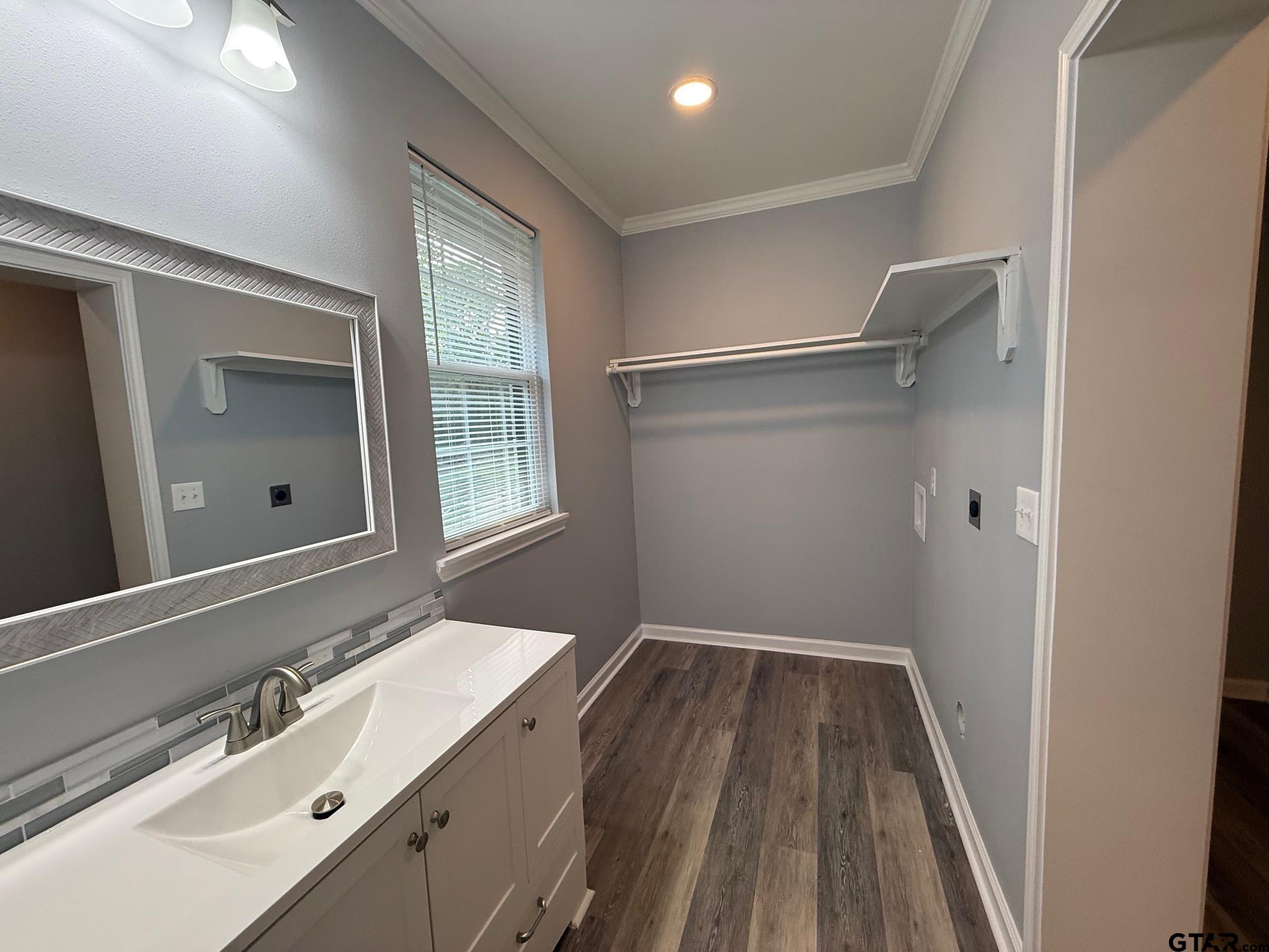 3248 Highway 79 Henderson, TX 75652 - Photo 22 of 44 a bathroom with a sink a mirror and a shower