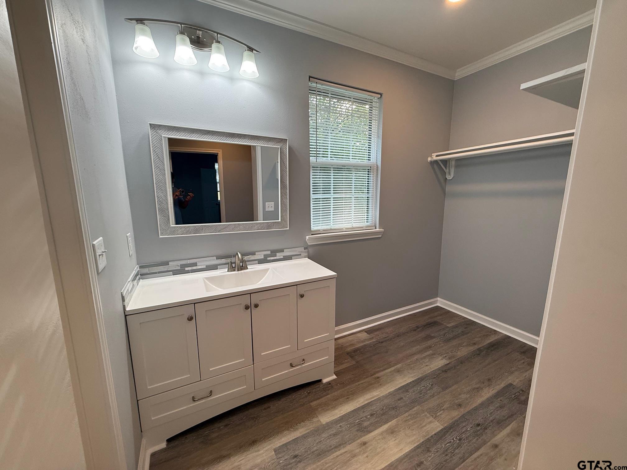 3248 Highway 79 Henderson, TX 75652 - Photo 23 of 44 a bathroom with a sink and mirror