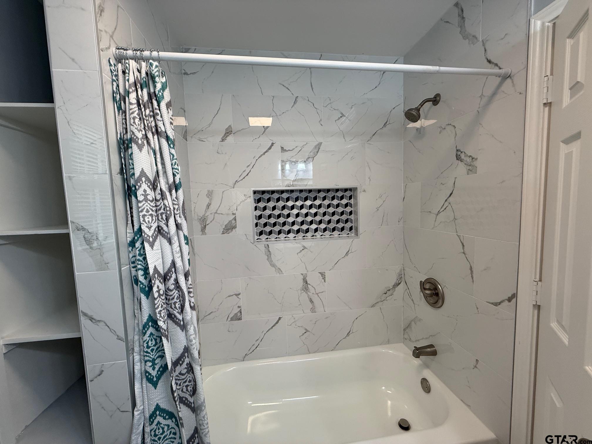 3248 Highway 79 Henderson, TX 75652 - Photo 25 of 44 a bathroom with a bathtub and shower