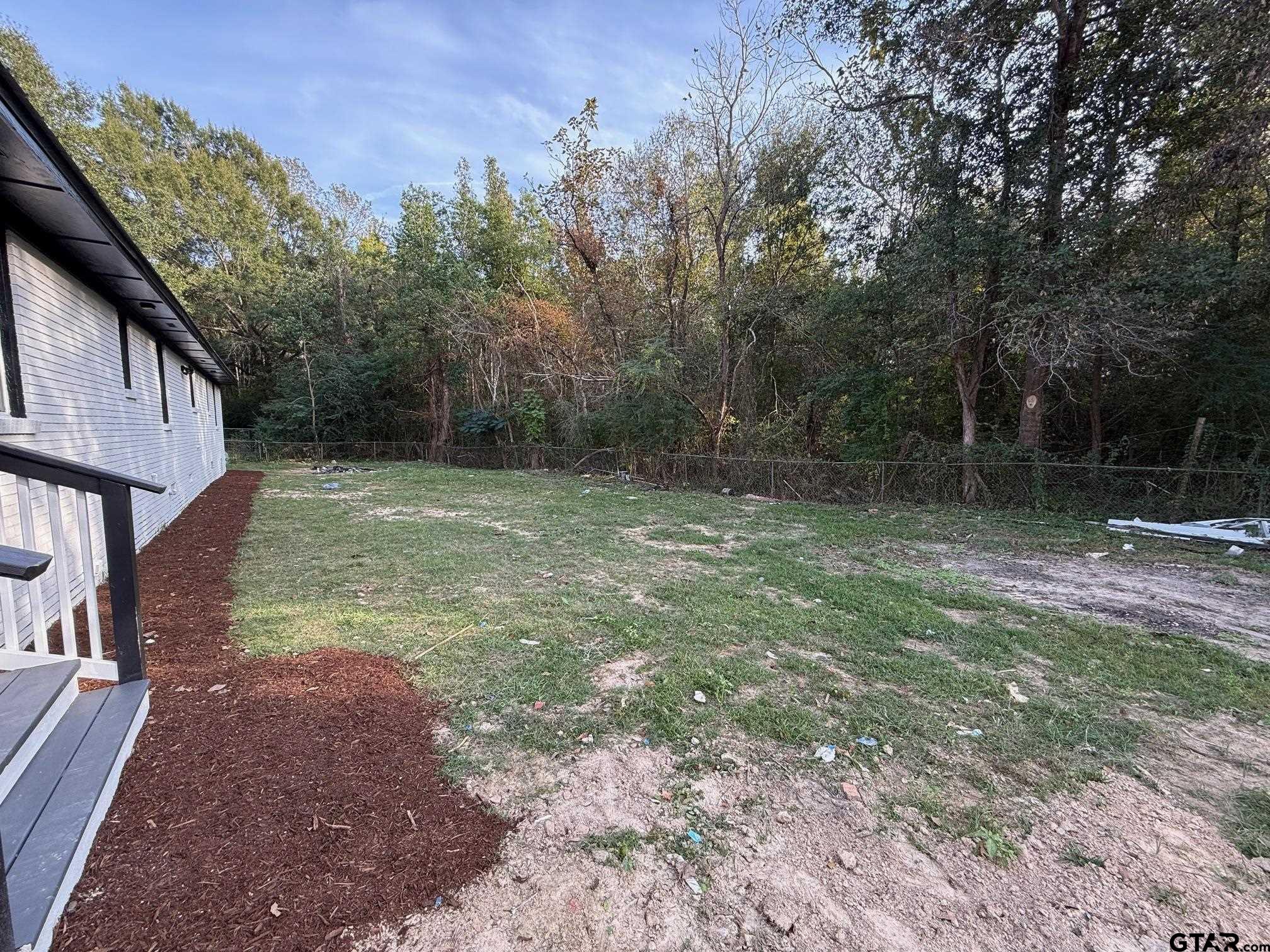 3248 Highway 79 Henderson, TX 75652 - Photo 41 of 44 a backyard of a house with lots of green space
