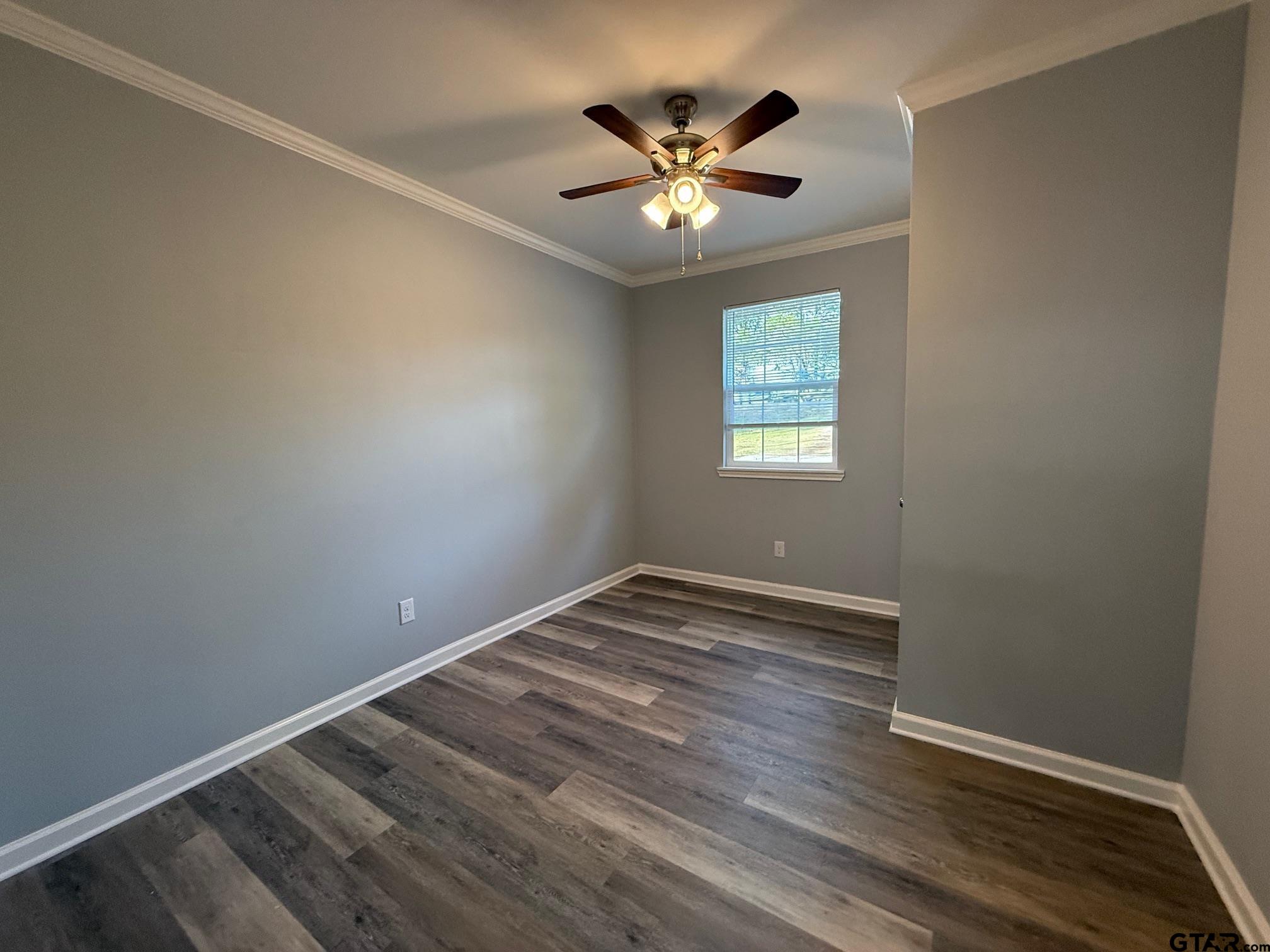 3248 Highway 79 Henderson, TX 75652 - Photo 44 of 44 wooden floor in an empty room with a window