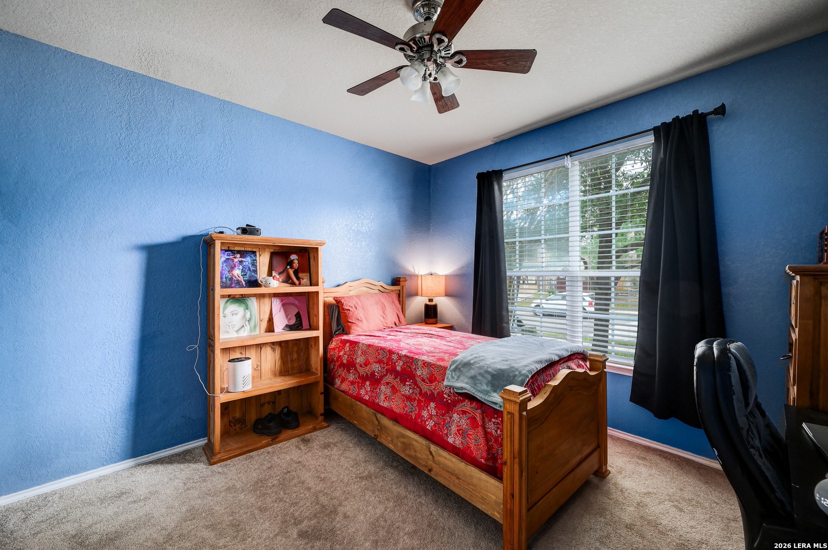 720 Hollow Ridge Schertz, TX 78108 - Photo 19 of 27 a bed sitting in a bedroom next to a window